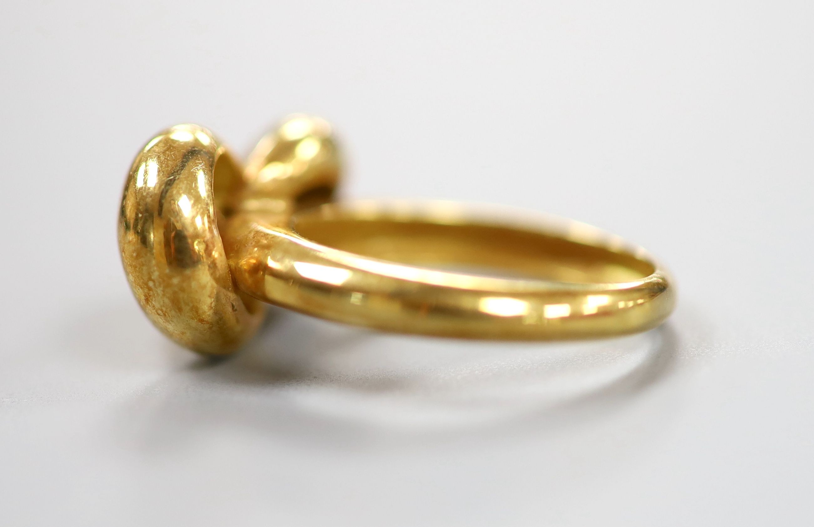 A 750 yellow metal 'knot' ring, size L, 6.4 grams.